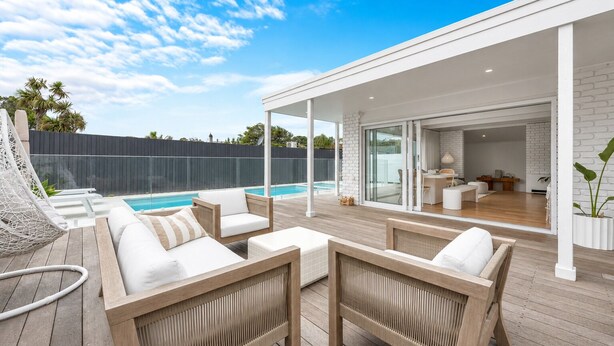 A covered outdoor area with a pool, wooden deck, and a view into the house. - Boutique Retreat Portsea by Ready Set Stay (Portsea)