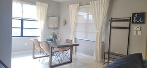 Enjoy meals in this inviting dining area with a glass-top table and comfortable seating for four.