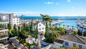 A marina with boats, a white building with a balcony, and a mountain in the background. - Lovely and luxury apartment in Altea, Costa Blanca, Spain for 6 persons (Altea)