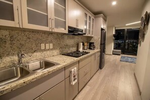 Fridge, microwave, stovetop, coffee/tea maker