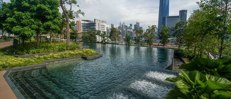 Outdoor pool, open 7:00 AM to 10:00 PM, pool umbrellas, pool loungers