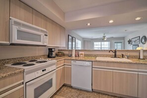 Microwave, dishwasher, cookware/dishes/utensils, paper towels - Branson Condo w/ Sunroom Near Downtown! (Branson)