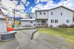 A two-story house with a covered porch and a small front yard. - Kooskia Sanctuary w/ Patio, Fire Pit & Grill! (Kooskia)
