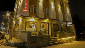 A multi-story building with a prominent sign reading "Lighthouses Cafe & Restaurant." - Lords Eco Inn Kathmandu (Kathmandu)