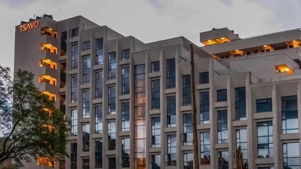 A multi-story building with a modern architectural design, featuring a prominent 'TSAVO' sign on the left side. - Stay.Plus Royal Suburbs By Tsavo (Nairobi)