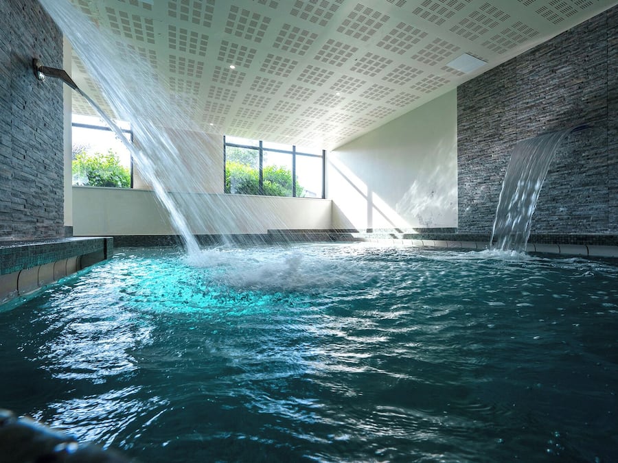 Indoor pool, outdoor pool, pool umbrellas, pool loungers