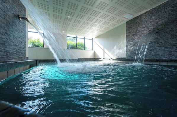 Indoor pool, outdoor pool, pool umbrellas, pool loungers