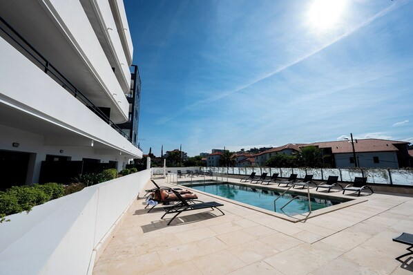 Indoor pool, outdoor pool, pool umbrellas, sun loungers