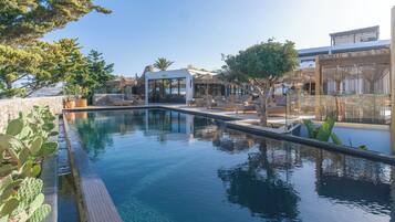 Outdoor pool, open 8:00 AM to 8:00 PM, pool umbrellas, pool loungers