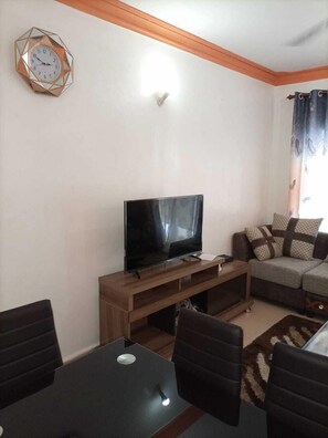 Family Apartment | Living area | 30-inch Smart TV with digital channels, TV - Stay.Plus Mtwapa Luxe Apartments (Mtwapa)