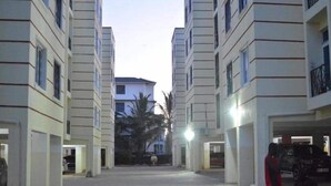 A multi-story residential building with a central courtyard. - Stay.Plus Mtwapa Luxe Apartments (Mtwapa)