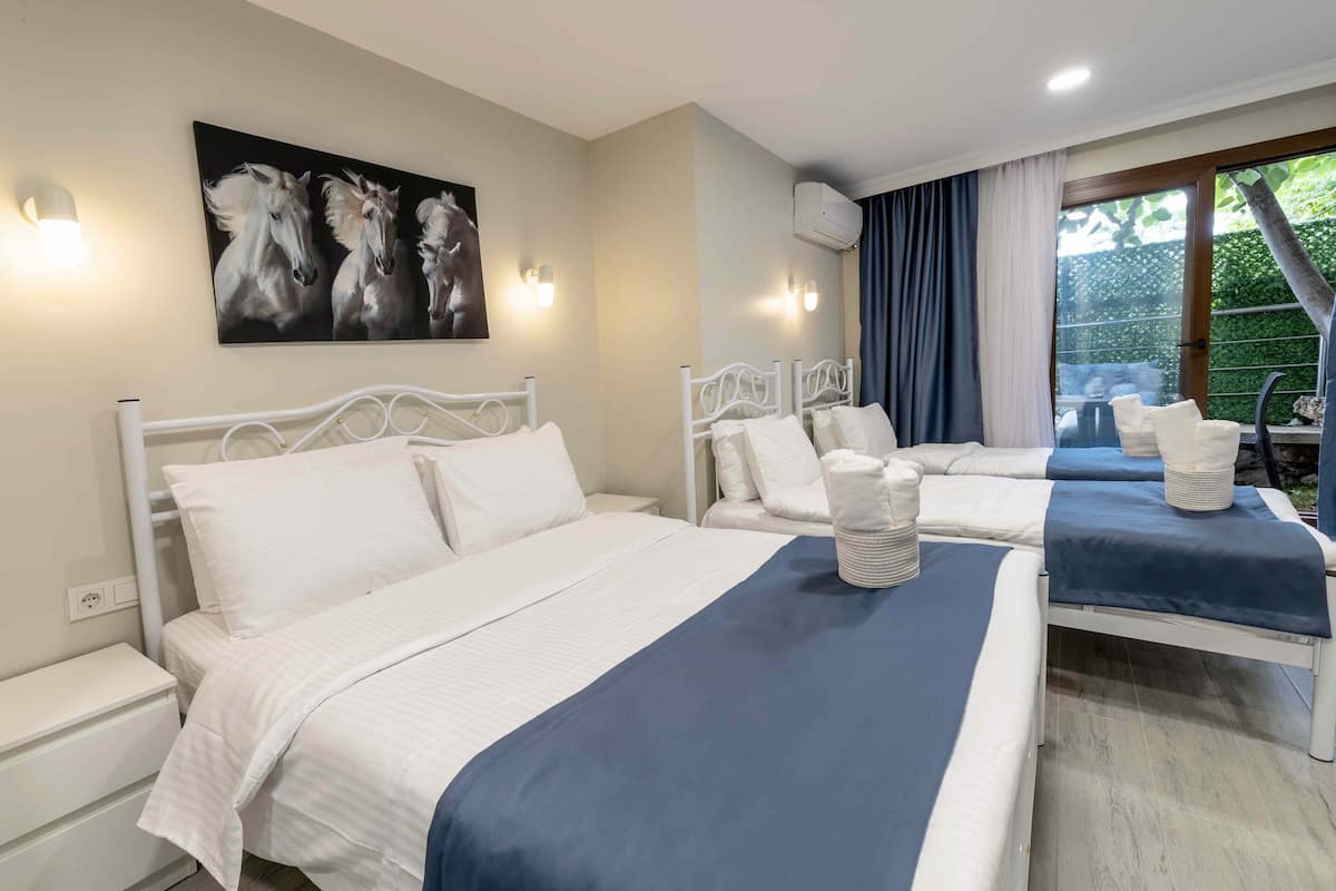 Standard Quadruple Room, Garden View | Free minibar items, free WiFi, bed sheets