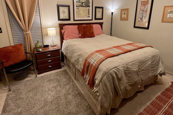 Private bedroom with queen size bed and room darkening shades