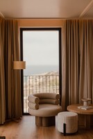 Junior Suite with Ocean View | Minibar, in-room safe, desk, soundproofing