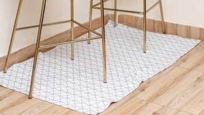 Two blue bar stools with gold legs in a kitchen area. - Stay.Plus Ruaka View Apartment (Ruaka)