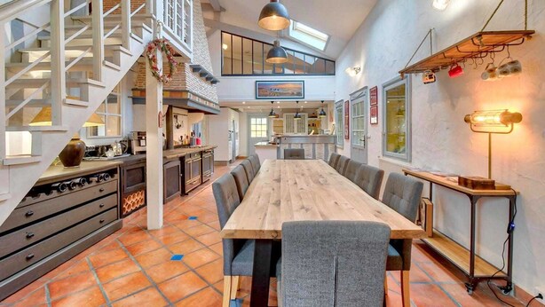 A spacious kitchen with a long wooden table, a staircase, and a loft area with a view. - Villa 230 M2 With Garden  Lac De Léon And Ocean (Léon)