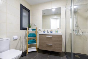 Shower, hair dryer, towels, soap
