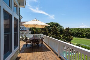 Enjoy a serene outdoor space with a table and chairs under a shaded area.