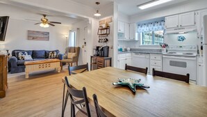 A modern kitchen with white cabinets, a built-in oven, and a coffee station. - Gorgeous 2 Bedroom Condo - Pool/Tiki Bar/Beach (Hilton Head Island)