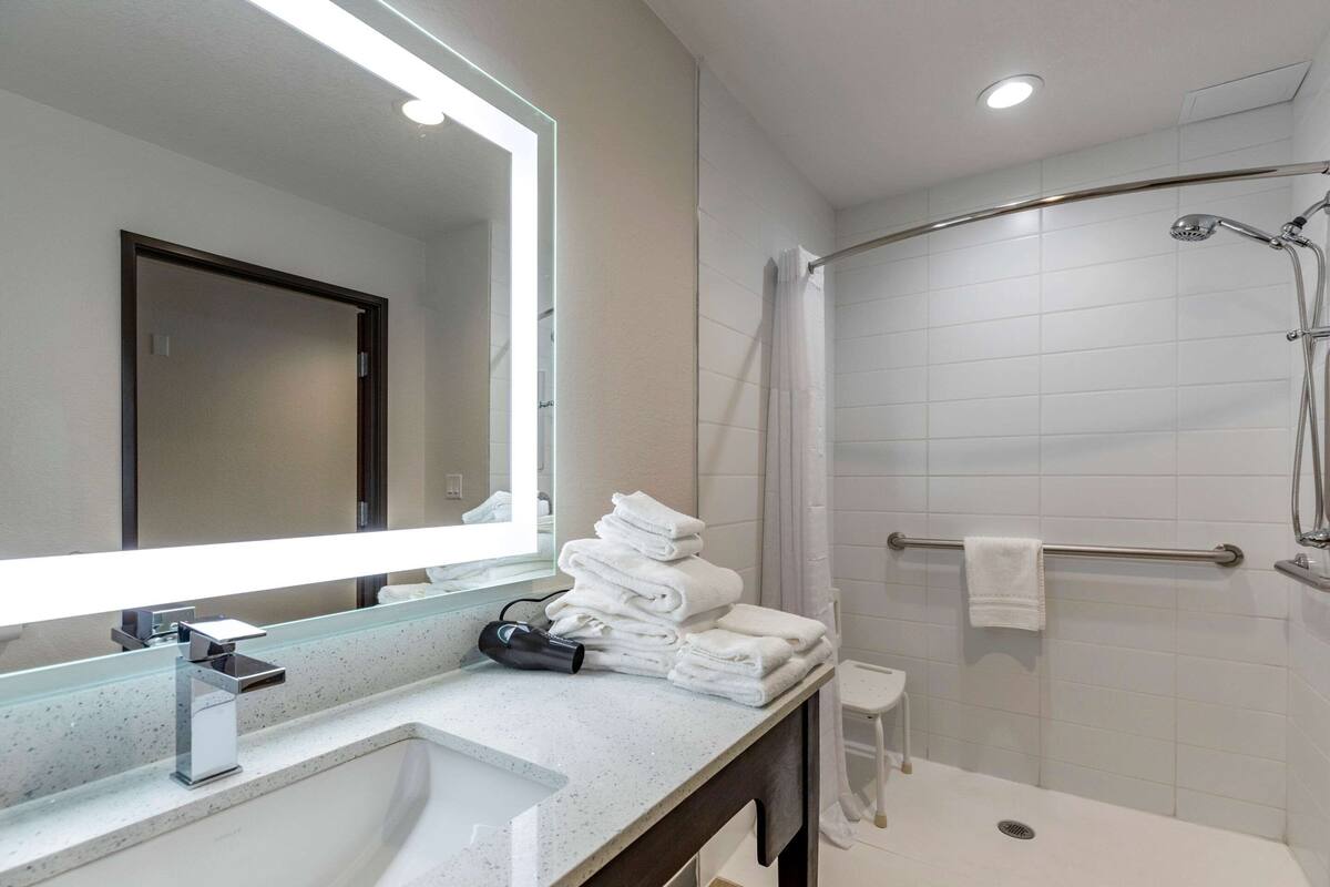 desk, laptop workspace, blackout curtains, iron/ironing board