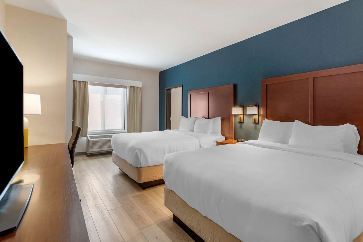 Suite, 2 Queen Beds, Non Smoking | Desk, laptop workspace, blackout curtains, iron/ironing board