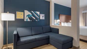 Suite, 1 King Bed, Non Smoking | Desk, laptop workspace, blackout curtains, iron/ironing board