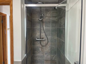 Bathtub, hair dryer, towels