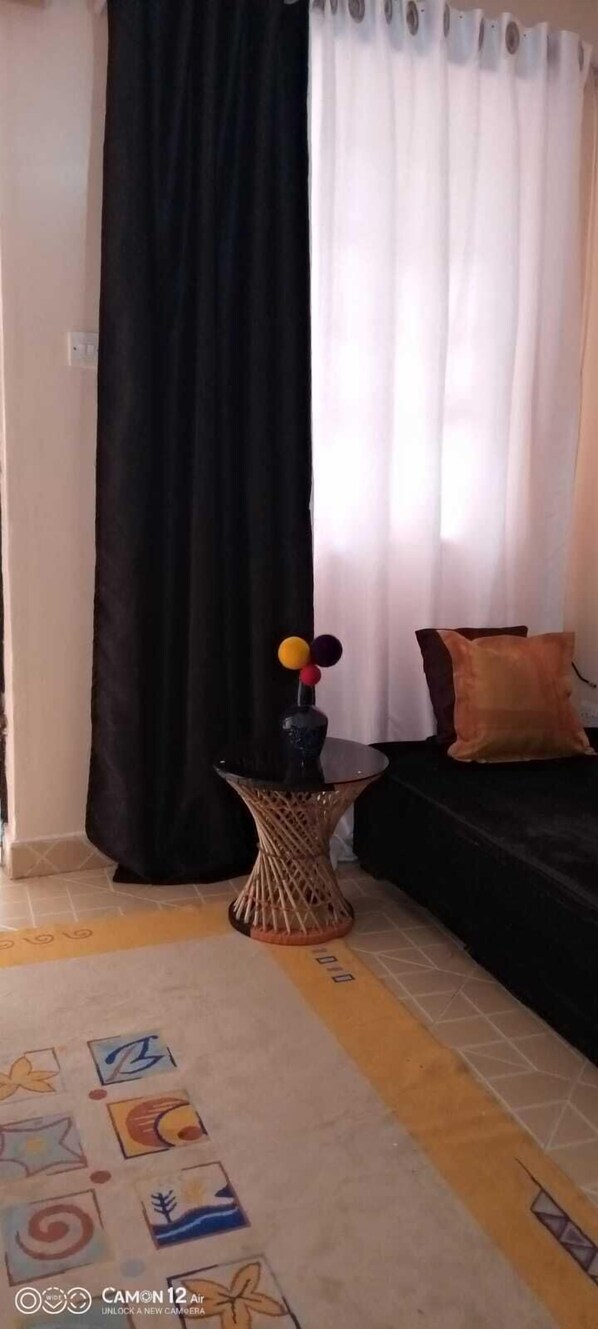 Economy Studio | Living area | 15-inch Smart TV with digital channels, TV - Stay.Plus TRM Deluxe Apartments (Nairobi)