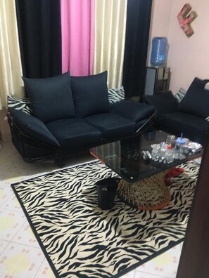 City Apartment | Living area | 15-inch Smart TV with digital channels, TV - Stay.Plus TRM Deluxe Apartments (Nairobi)