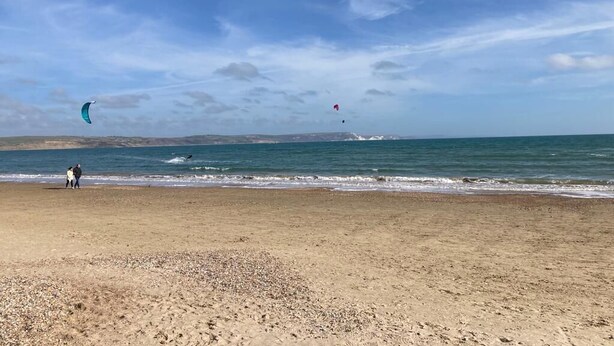 A beach with a clear sky and calm sea. - Relax by the Sea (Weymouth)