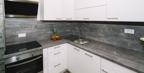 Apartment (Bled Castle view with terrace) | Private kitchen | Fridge, dining tables - Bled Paradise Apartments (Bled)