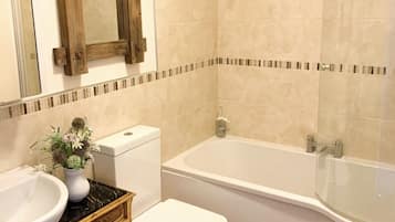 Apartment, Multiple Beds | Bathroom | Combined shower/tub, deep soaking tub, free toiletries, towels