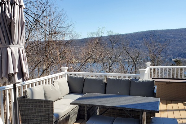 huge dock with a grill and beautiful view of the lake
