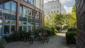 A modern building with large windows and a brick facade.