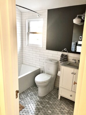 Combined shower/tub, hair dryer, towels, soap