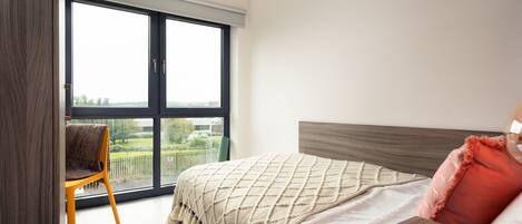 Desk, laptop workspace, free WiFi, bed sheets