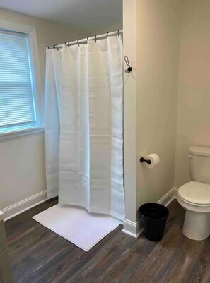 Combined shower/tub, toilet paper
