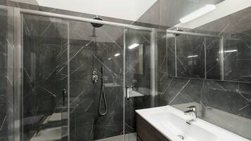 Designer toiletries, hair dryer, towels