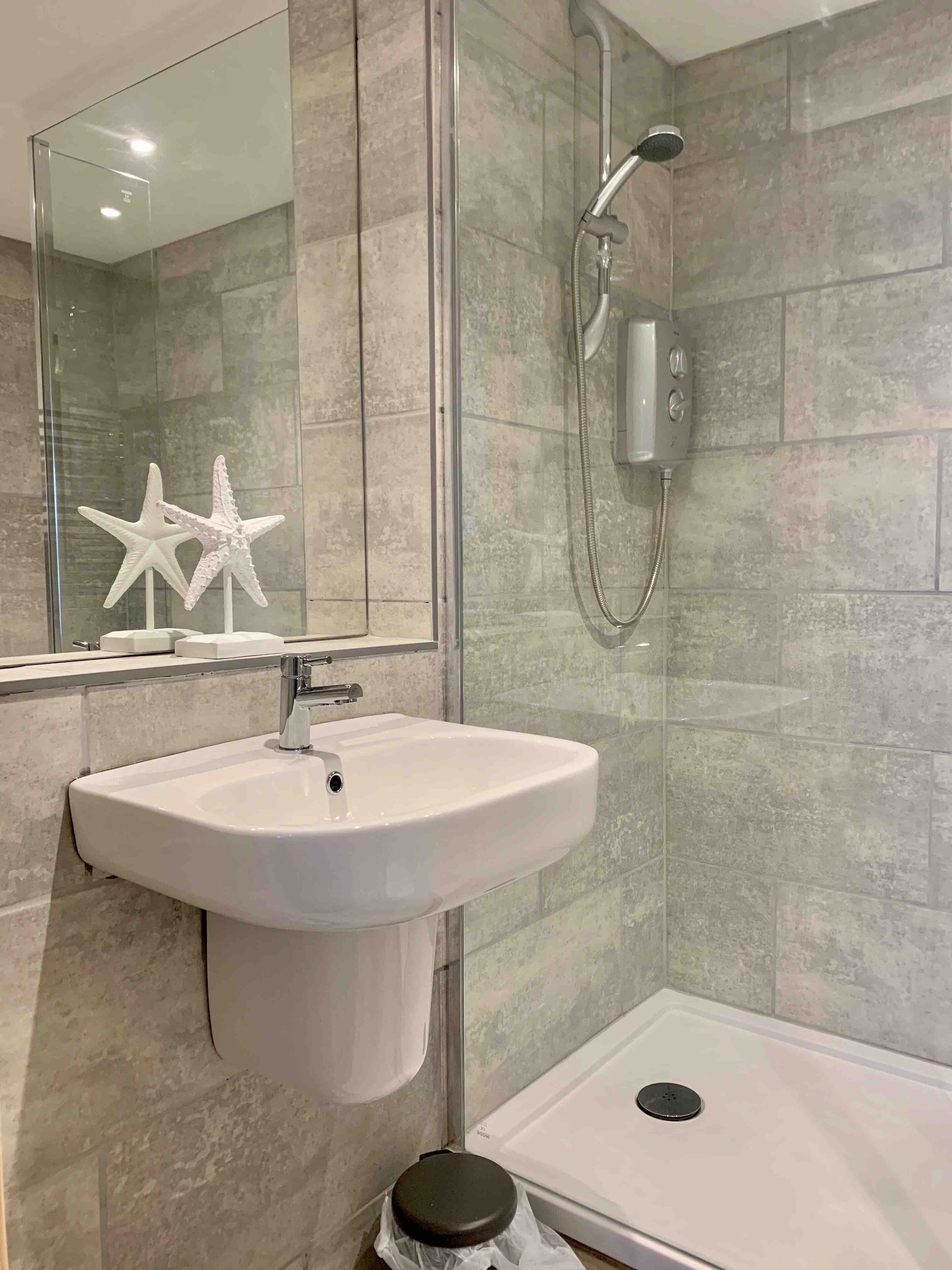 Shower, eco-friendly toiletries, hair dryer, towels