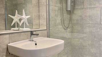 Shower, eco-friendly toiletries, hair dryer, towels