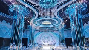 A grand hall with a central stage, ornate ceiling, and floral arrangements. - Qinyuan Zhixuan Hot Spring Hotel (Sanyuan)