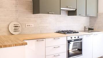 Fridge, oven, dishwasher, dining tables