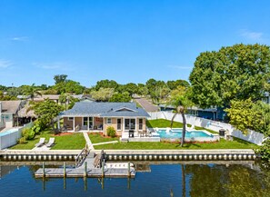 Aerial back view of the property showcasing the beautiful heated pool and access to dock in the lake. Don't miss the opportunity and book now! - NEW Heated Salt Pool & Spa on Waterfront Canal (Tampa)