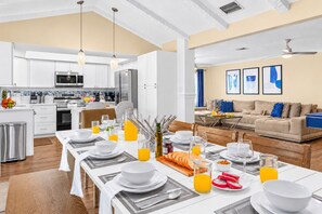 Open-concept dining, kitchen, and living area designed for effortless entertaining.