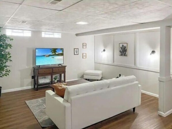 Relax in this stylish living room with a sofa set, flat-screen TV, and coffee table.