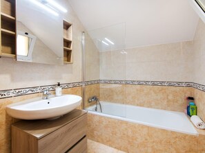 Bathtub, hair dryer, towels