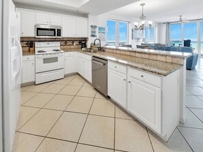 Fridge, microwave, stovetop, coffee/tea maker