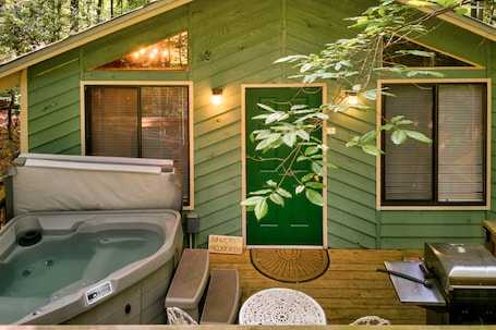 Outdoor spa tub. Private & secluded cabin with a hot tub, WiFi, firepit, & full kitchen