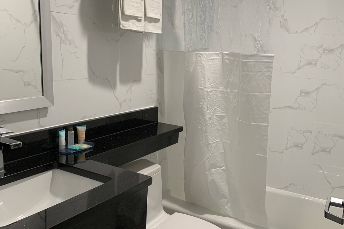 bathtub, free toiletries, towels, soap