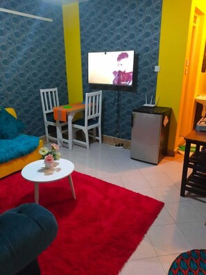 Economy Studio | Living area | 20-inch Smart TV with digital channels, TV - Stay.Plus Sana Sana Studio Apartment (Nairobi)